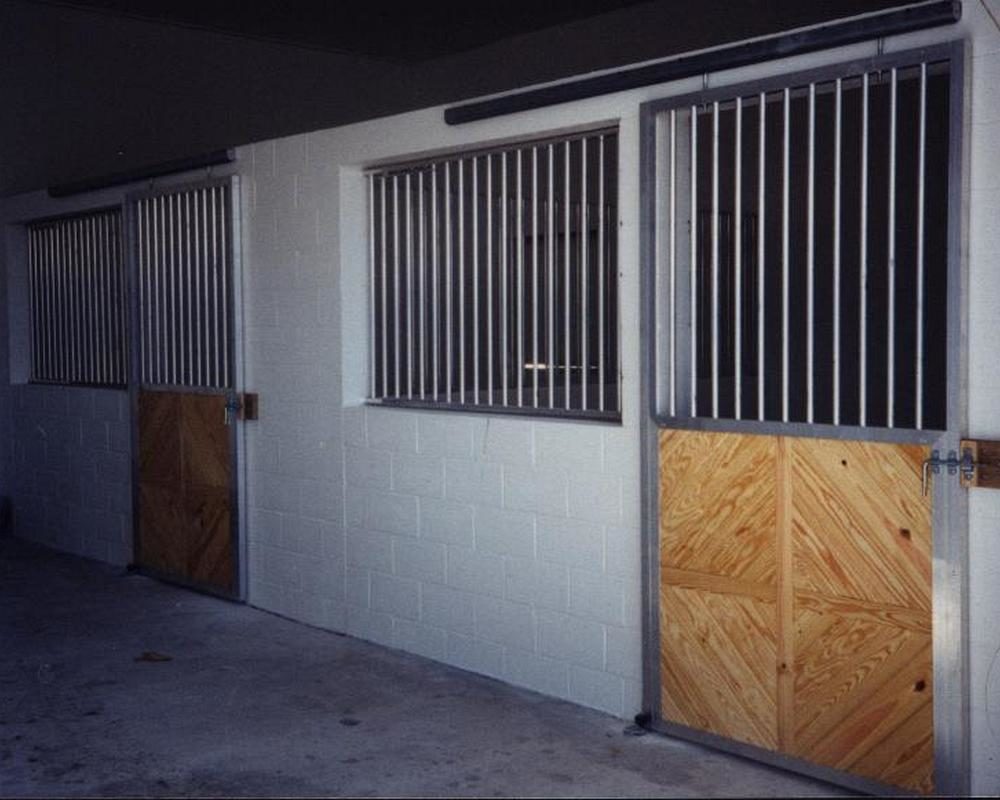 Horse stall front with unique fascia door.