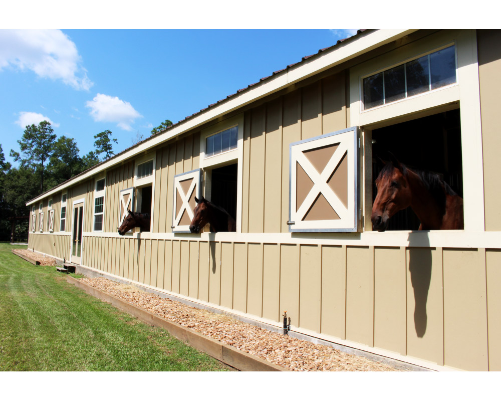 Crossbuck hinged exterior barn shutters.