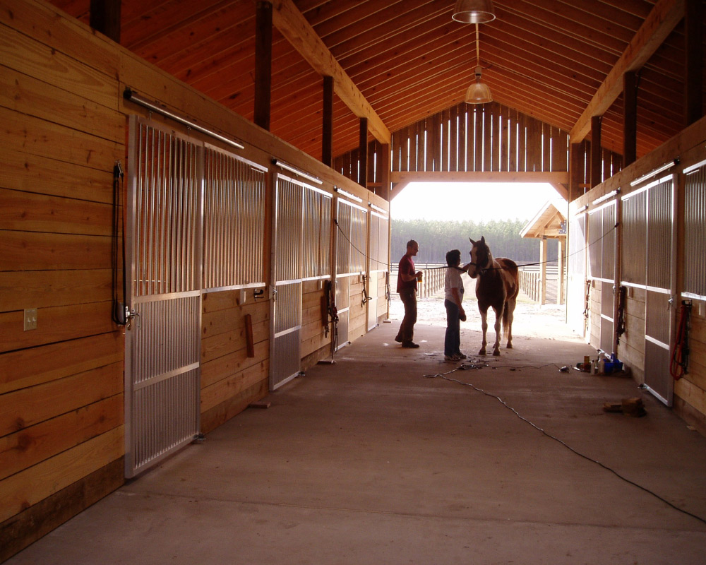 Beautiful horse stall barn aisle way.