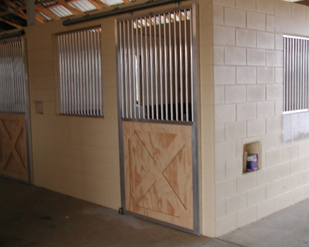 Crossbuck sliding door and stall front grill.