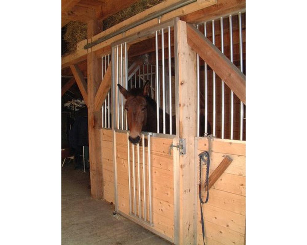 Sliding horse stall door with spring loaded fold down panel.