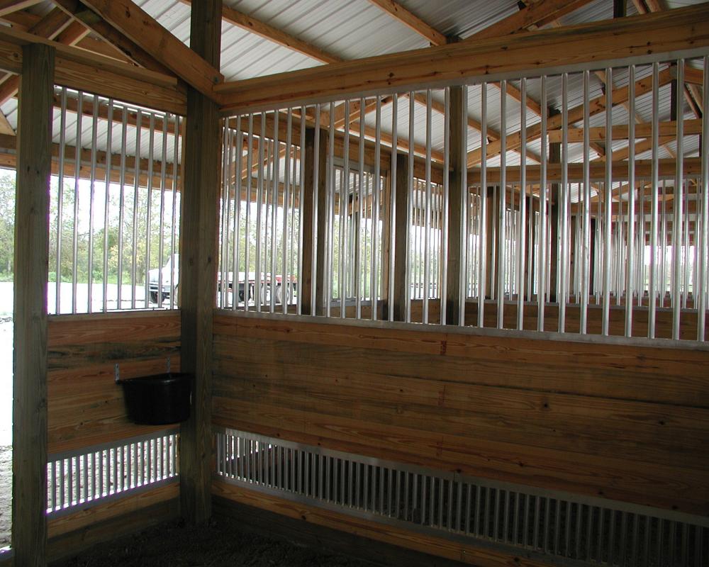 Aluminum grills and vent panels used to add ventilation to horse stalls.