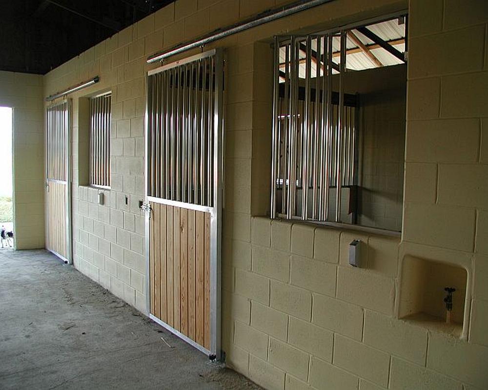 Tongue and groove sliding stall doors.