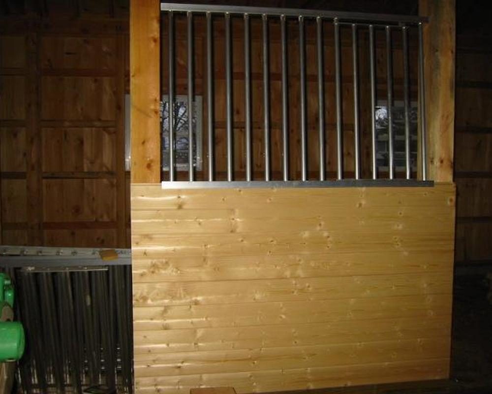 Horse stall front with aluminum grill.