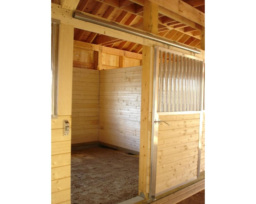 Sliding horse stall door with local lumber inserted.