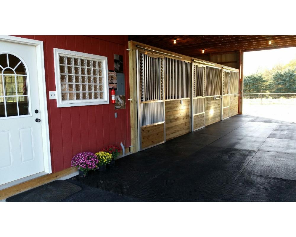 Sliding horse stall doors with kick plate and fold down panel top.