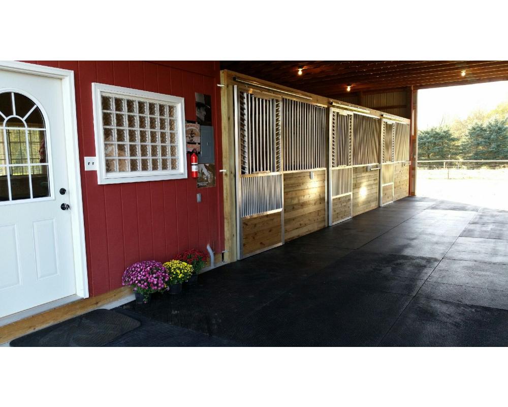 Sliding horse stall doors with kick plate and fold down panel top.
