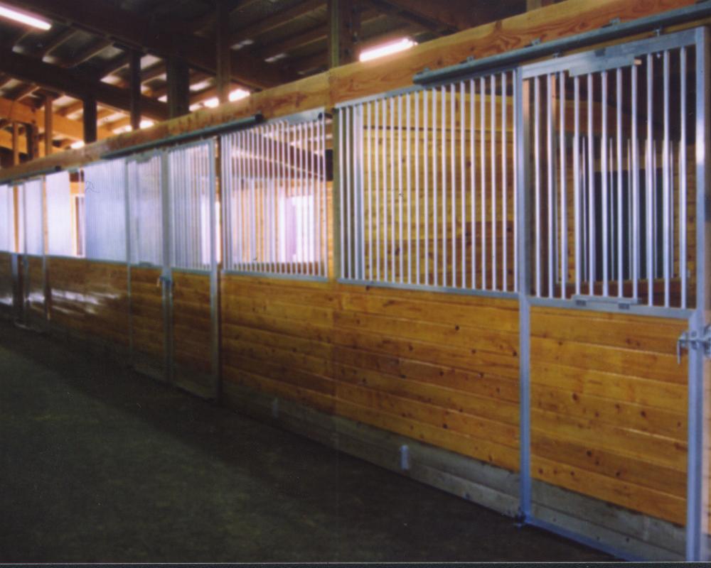 Horse stall front with superstructure sliding door.