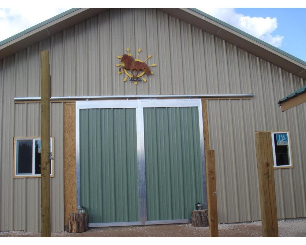 Customized end barn doors, with matching material of barn inserted into frame instead of lumber.