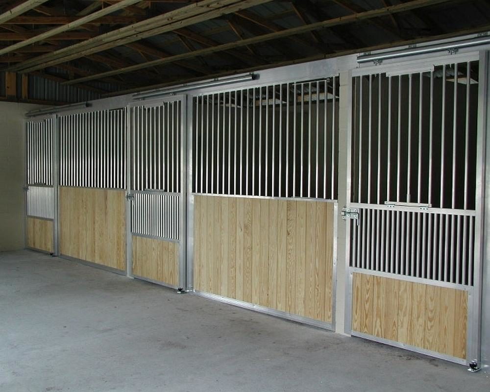 Coolbreeze ventilated sliding horse stall doors with scuff panel.
