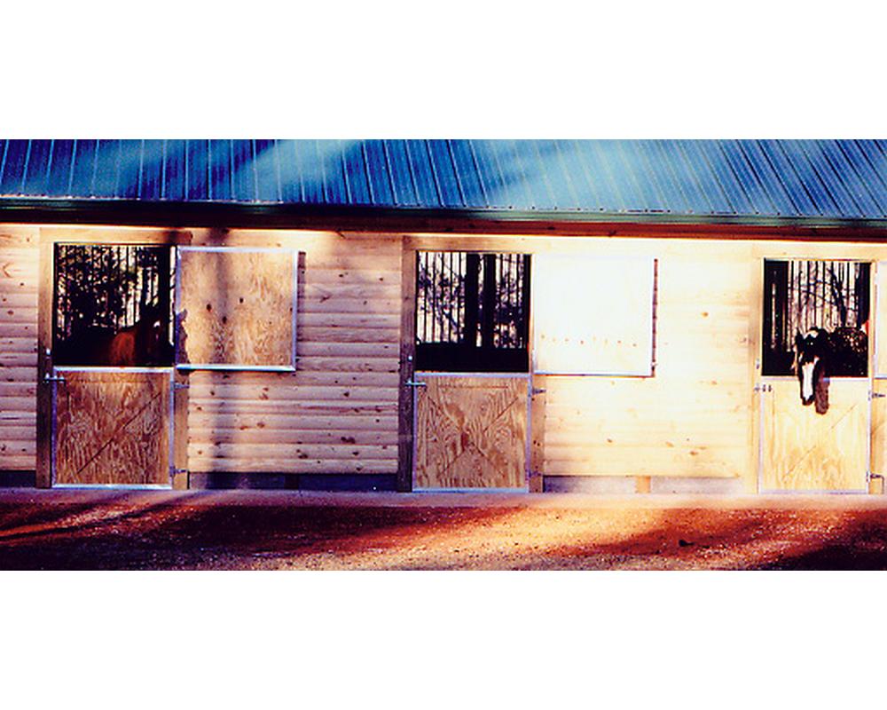 Crossbuck double dutch doors on exterior of barn.
