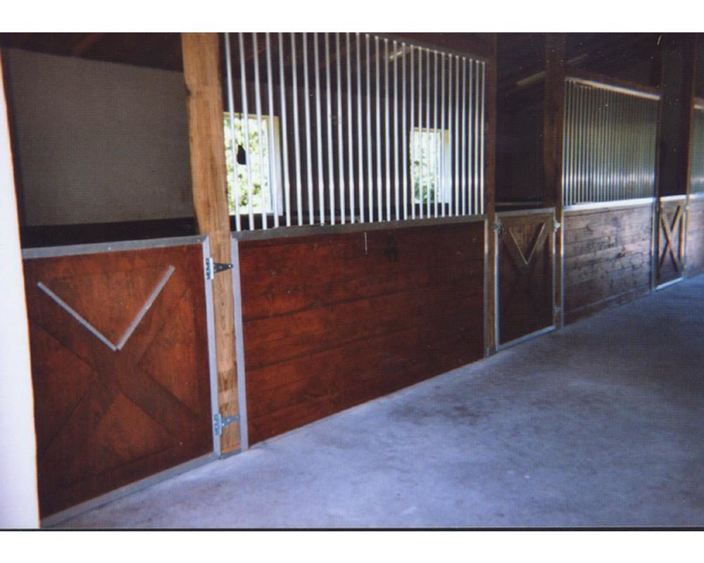 Hinged crossbuck half gate and stall grills.