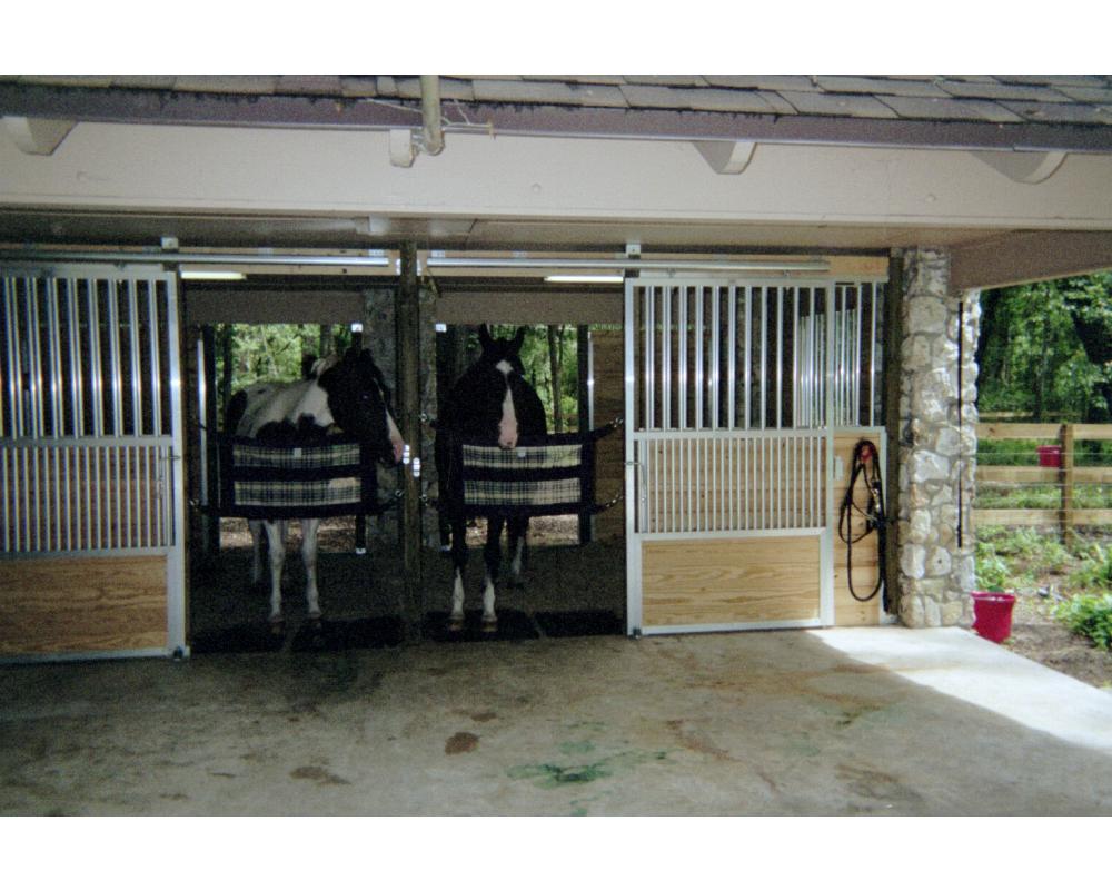 Horse stall front with sliding doors.