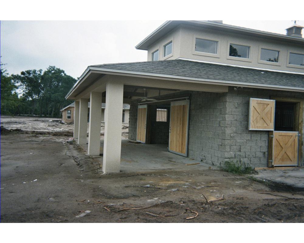 Exterior of Putzke horse barn with dutch doors and end barn sliding doors.