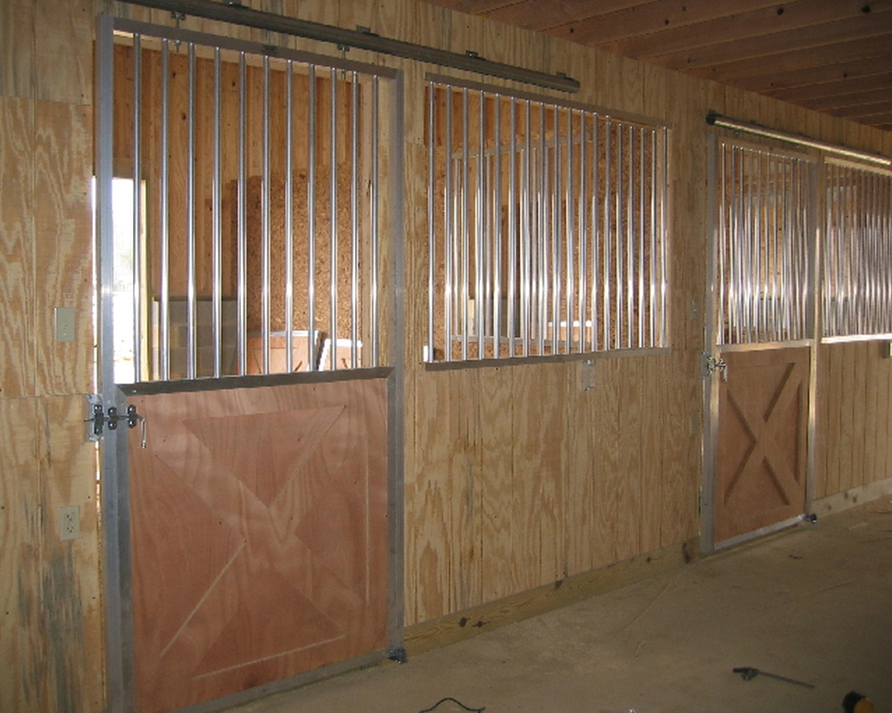 Sliding crossbuck lumber horse stall door.