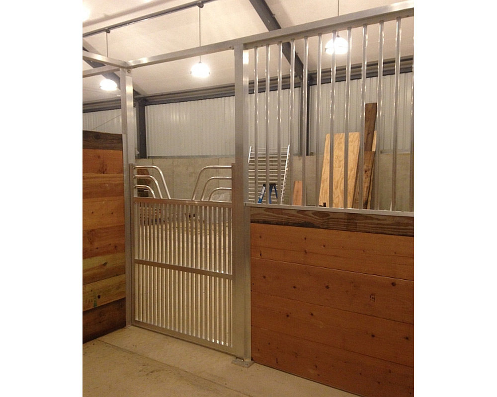 Horse stall front featuring aluminum front grill and coolbreeze gossip gate.