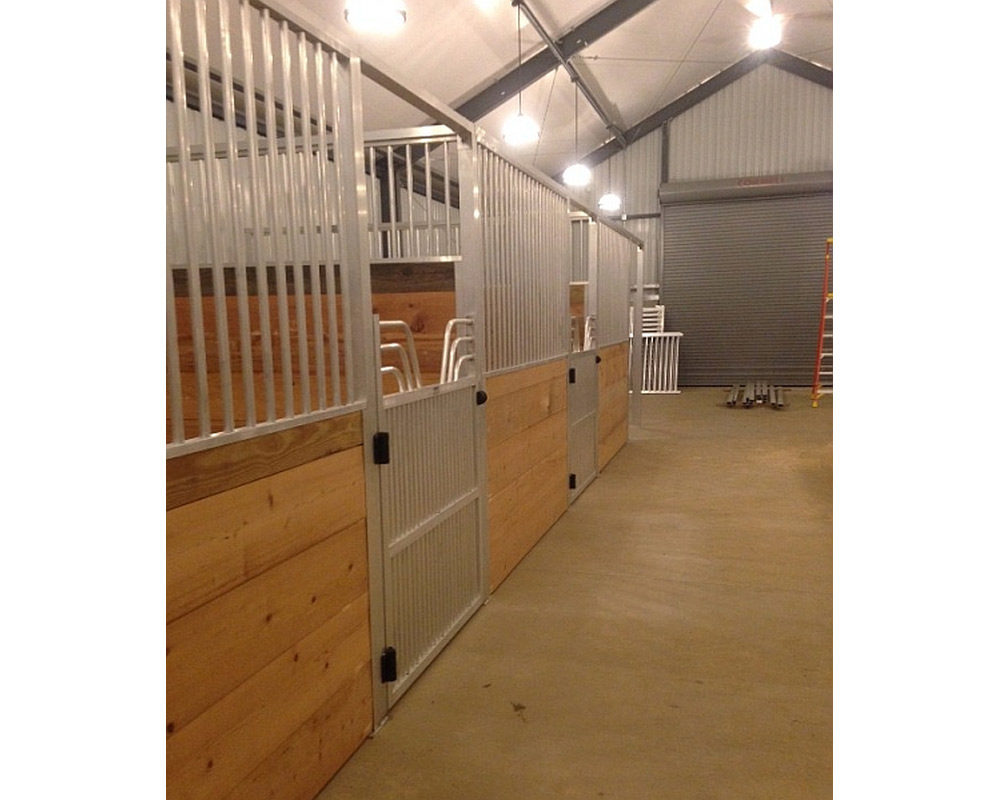 Aluminum stall front grills and hinged aluminum horse gate.