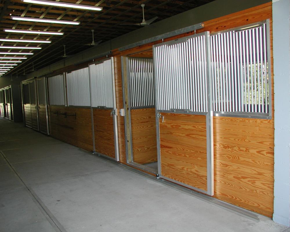 Tongue and groove sliding horse stalls doors.