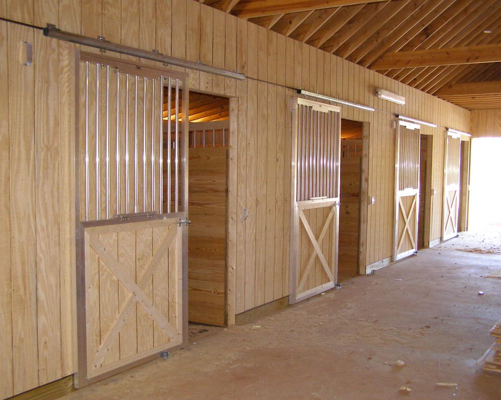 Horse stalls with sliding doors.