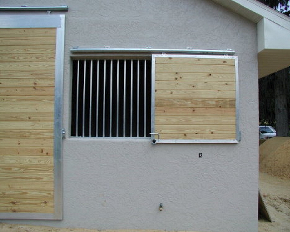 Sliding horse barn shutters.