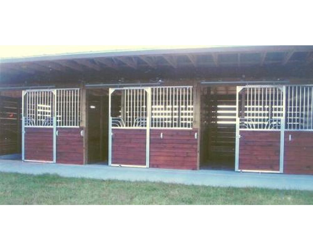 Sliding horse stall doors on barn exterior.