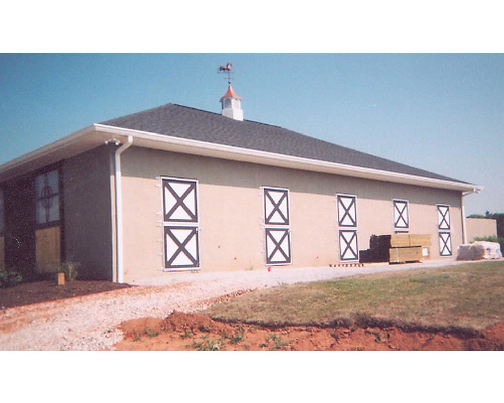 Exterior barn doors with crossbuck double dutch doors.