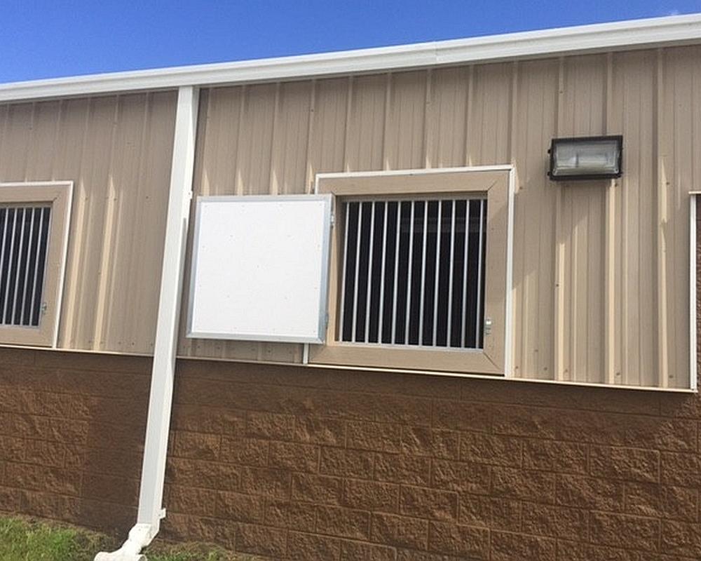 Single panel hinged barn shutters.