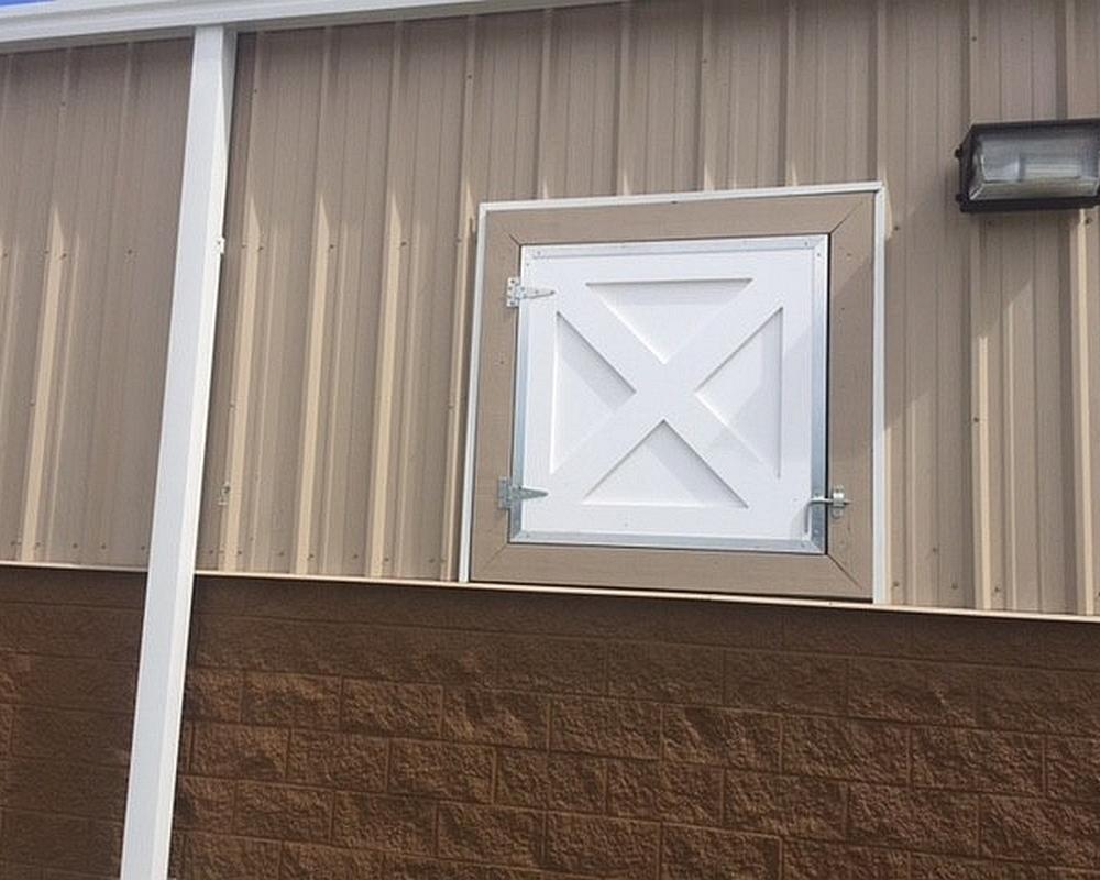 Crossbuck shutters made of durable PVC Endura product.