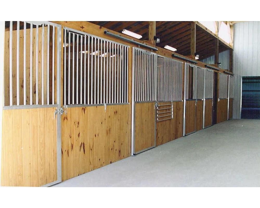 Horse stall fronts with sliding stall doors.