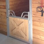 Miniature horse stall gate with crossbuck lumber and gossip yoke top.