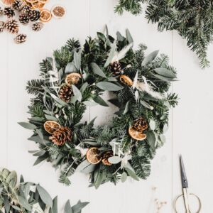 Natural wreath made of leaves, pine cones and dried fruits.