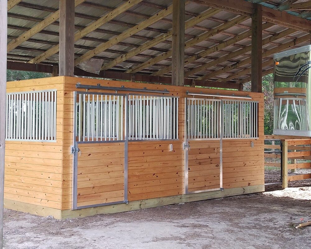 Sliding aluminum horse stall doors and aluminum stall front grills.