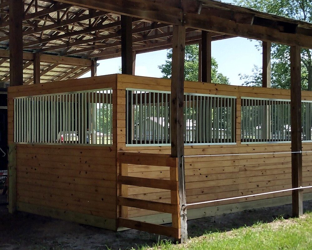 Yeatts horse barn, sliding horse stall doors and aluminum grills.